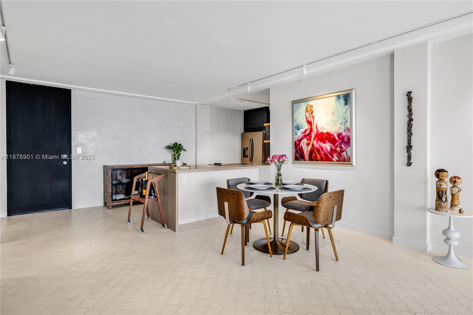 770 Northeast 69th Street, Unit 6H Miami, FL 33138 - Photo 17 of 71 a dinning room with furniture and a flat screen tv