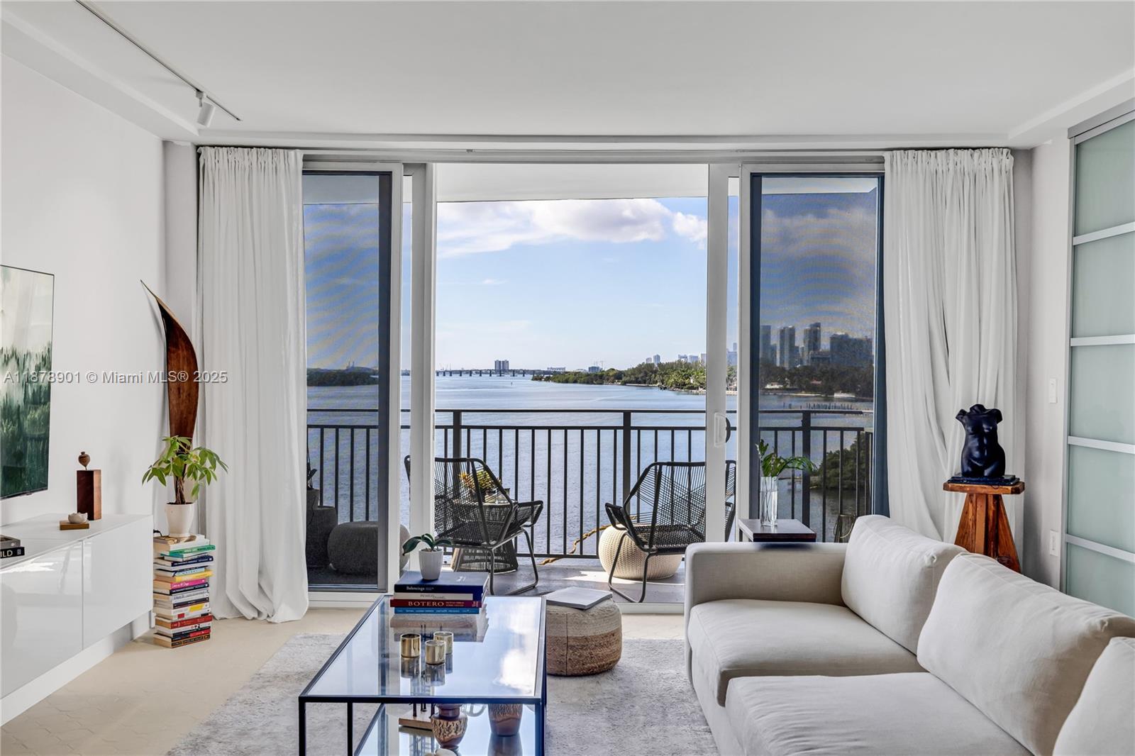 770 Northeast 69th Street, Unit 6H Miami, FL 33138 - Photo 23 of 71 a living room with furniture and a large window