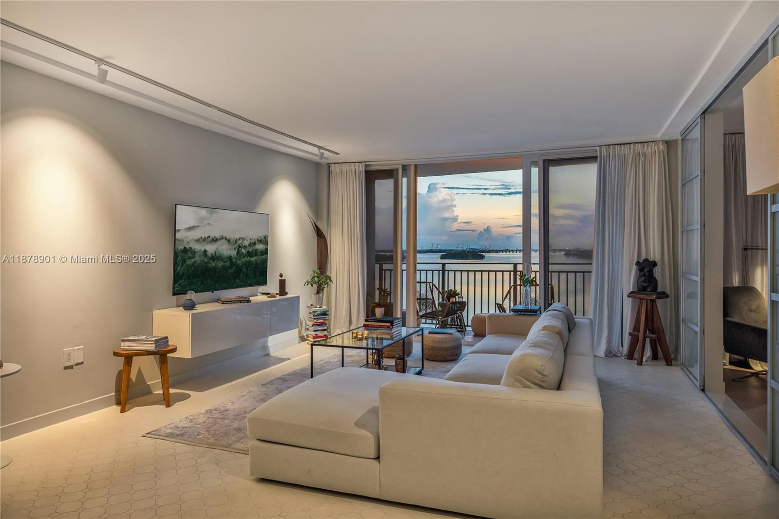 770 Northeast 69th Street, Unit 6H Miami, FL 33138 - Photo 24 of 71 a living room with furniture and a large window