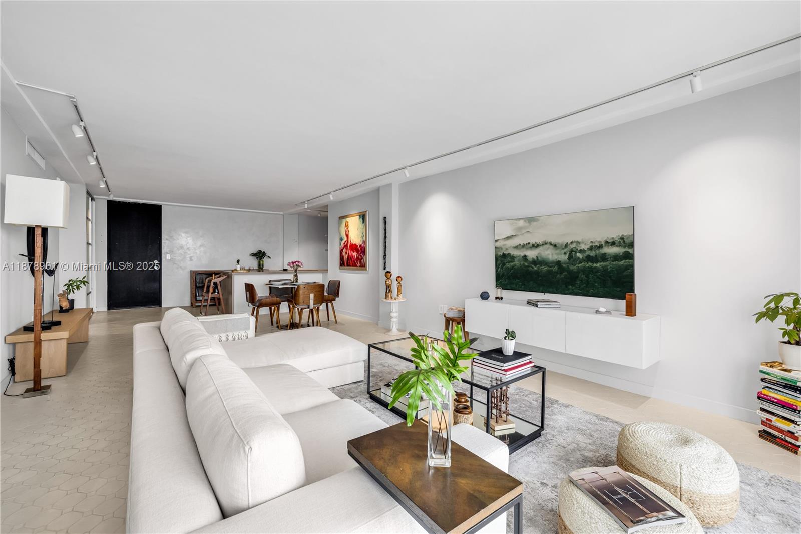 770 Northeast 69th Street, Unit 6H Miami, FL 33138 - Photo 25 of 71 a living room with furniture and a flat screen tv