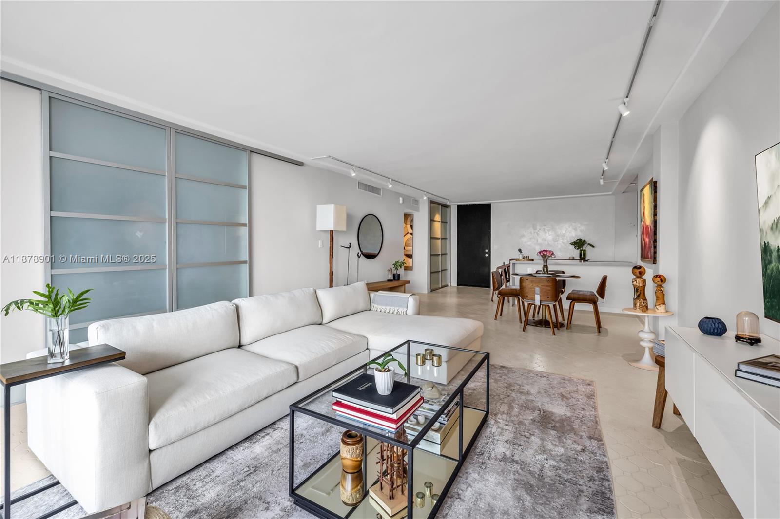 770 Northeast 69th Street, Unit 6H Miami, FL 33138 - Photo 26 of 71 a living room with furniture and wooden floor