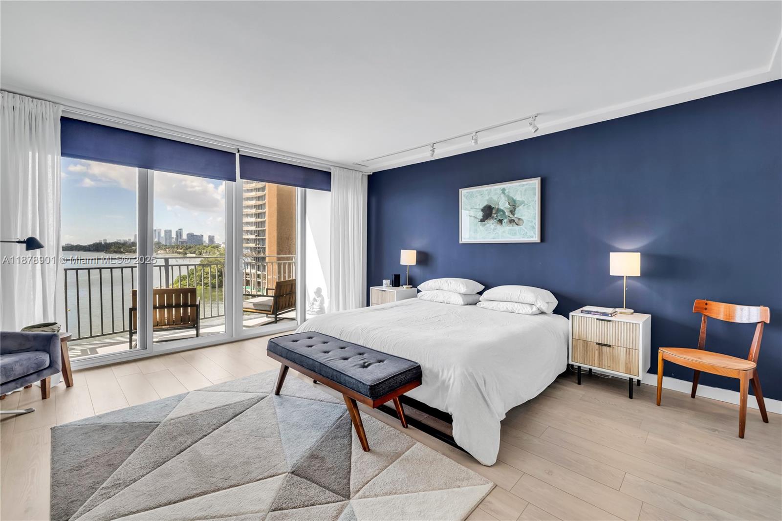 770 Northeast 69th Street, Unit 6H Miami, FL 33138 - Photo 27 of 71 a bedroom with a bed and a large window