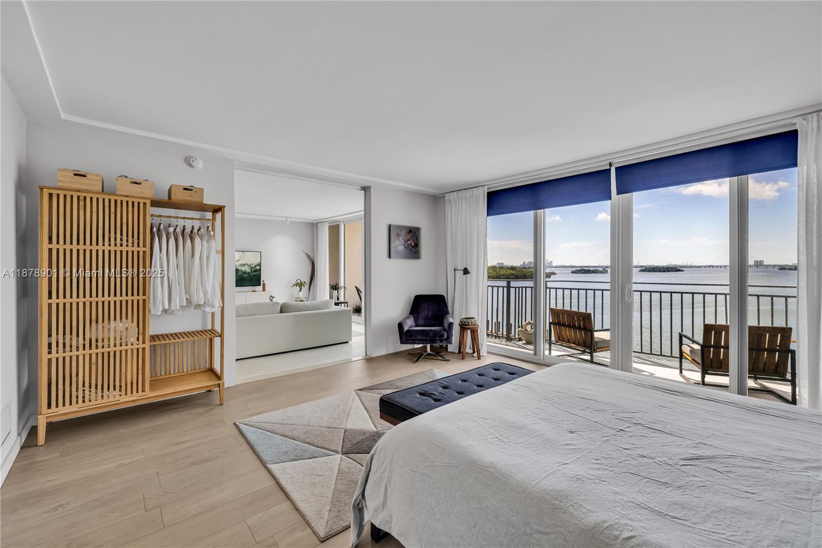 770 Northeast 69th Street, Unit 6H Miami, FL 33138 - Photo 28 of 71 a bedroom with furniture and large windows