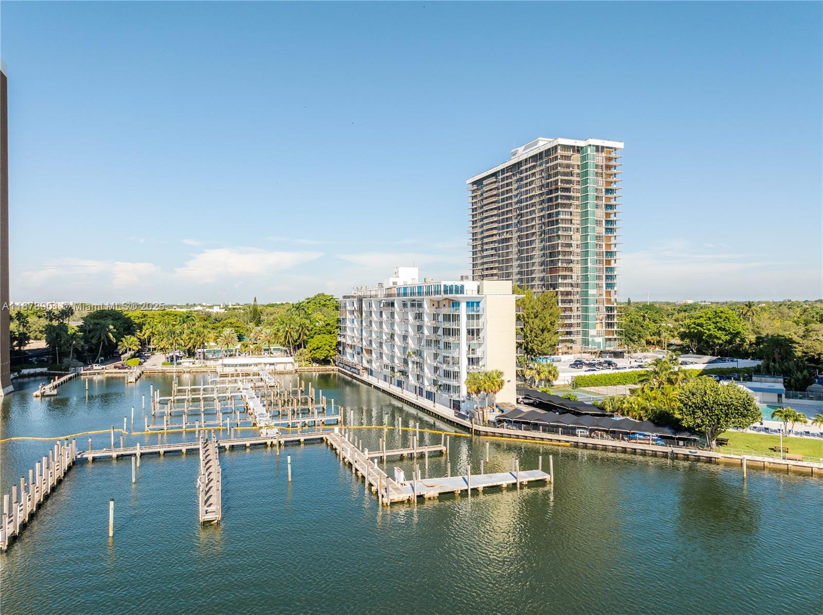 770 Northeast 69th Street, Unit 6H Miami, FL 33138 - Photo 34 of 71 a view of swimming pool with outdoor seating and lake view