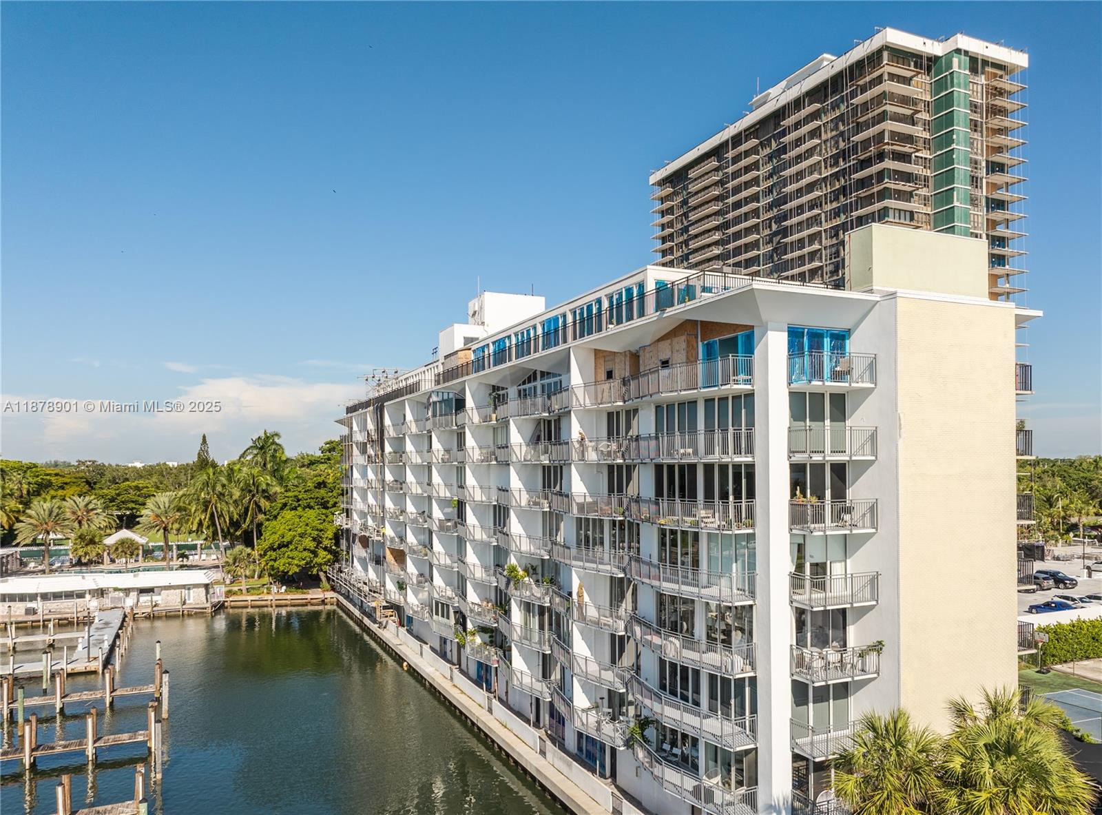 770 Northeast 69th Street, Unit 6H Miami, FL 33138 - Photo 42 of 71 a front view of a building with lake view