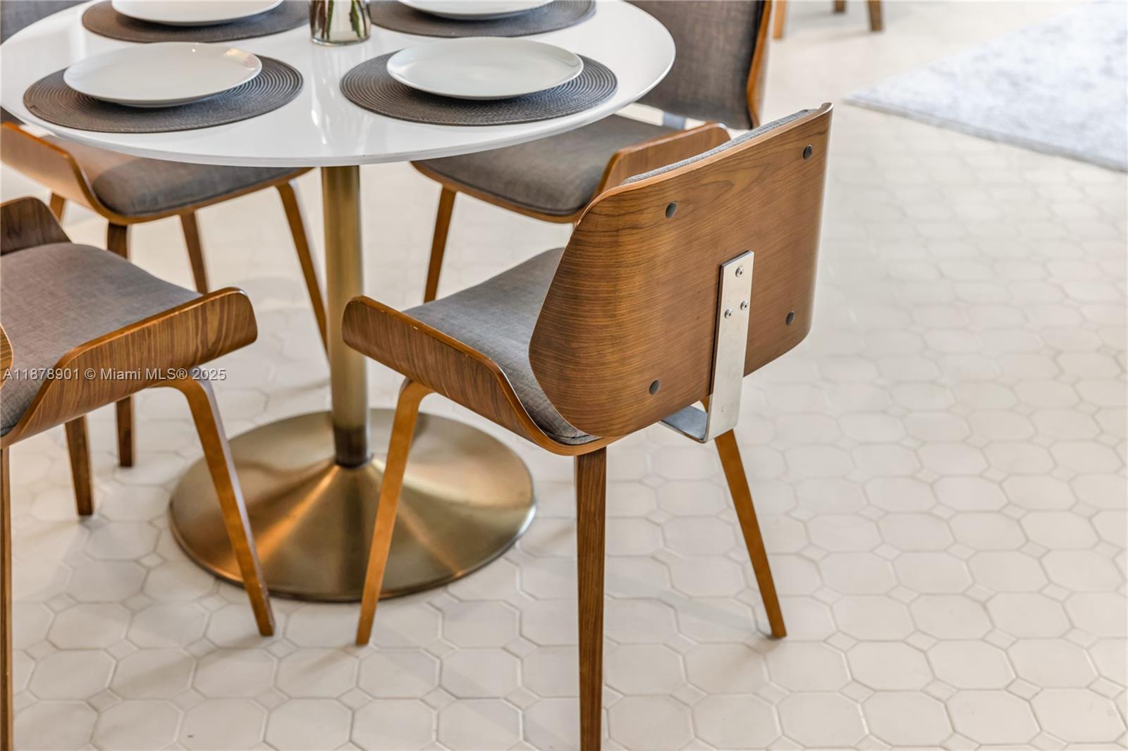 770 Northeast 69th Street, Unit 6H Miami, FL 33138 - Photo 54 of 71 a view of a dining room with furniture and wooden floor