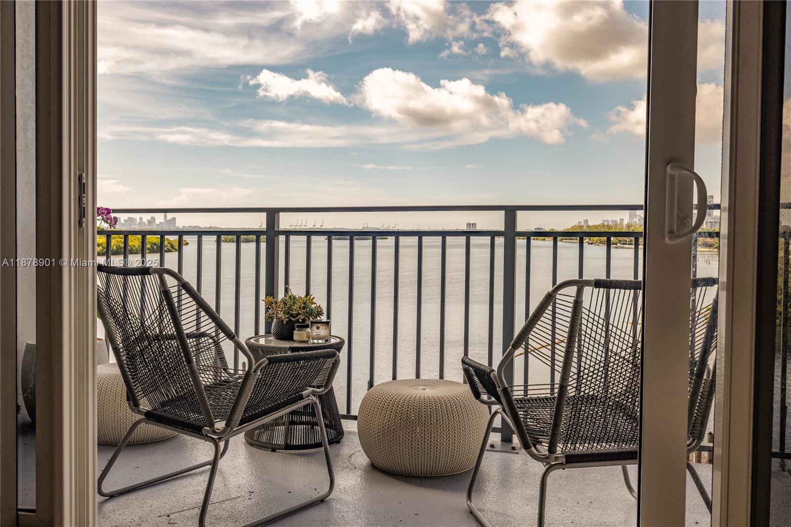 770 Northeast 69th Street, Unit 6H Miami, FL 33138 - Photo 61 of 71 a view of a balcony with chair and iron fence