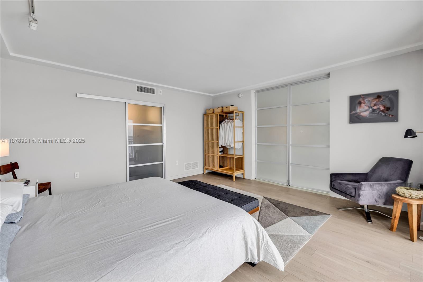 770 Northeast 69th Street, Unit 6H Miami, FL 33138 - Photo 69 of 71 a bedroom with a bed and chair