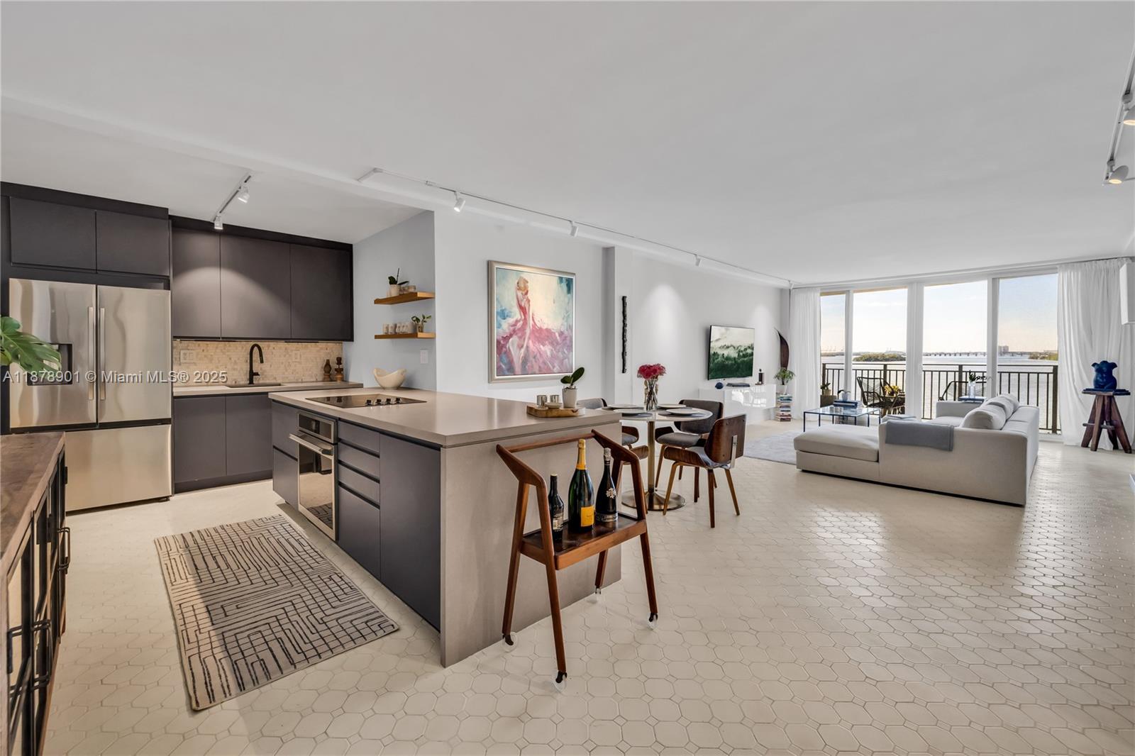 770 Northeast 69th Street, Unit 6H Miami, FL 33138 - Photo 9 of 71 a living room with furniture and a flat screen tv