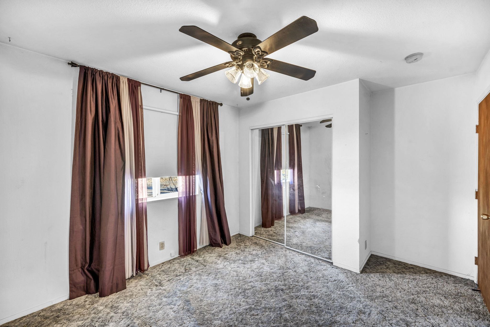 446-460 Lake View Drive Herlong, CA 96113 - Photo 8 of 13 a view of a livingroom with a chandelier fan and a refrigerator