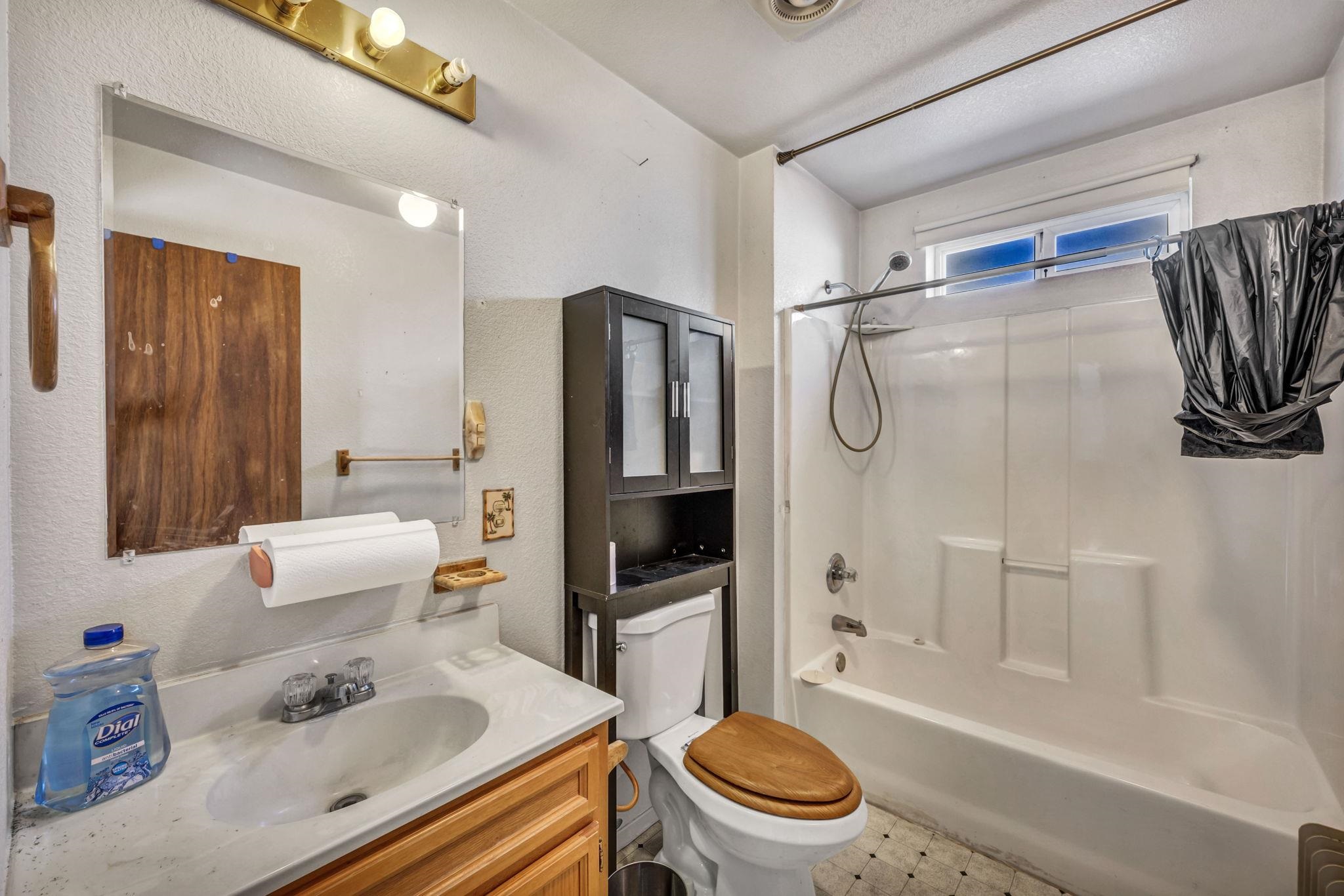 446-460 Lake View Drive Herlong, CA 96113 - Photo 9 of 13 a bathroom with a sink toilet and shower