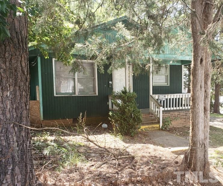 102 St Augustine Raleigh, NC 27610 - Photo 1 of 11 a front view of a house with a yard