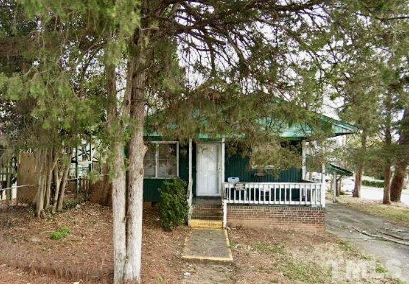 102 St Augustine Raleigh, NC 27610 - Photo 2 of 11 front view of a house with a tree