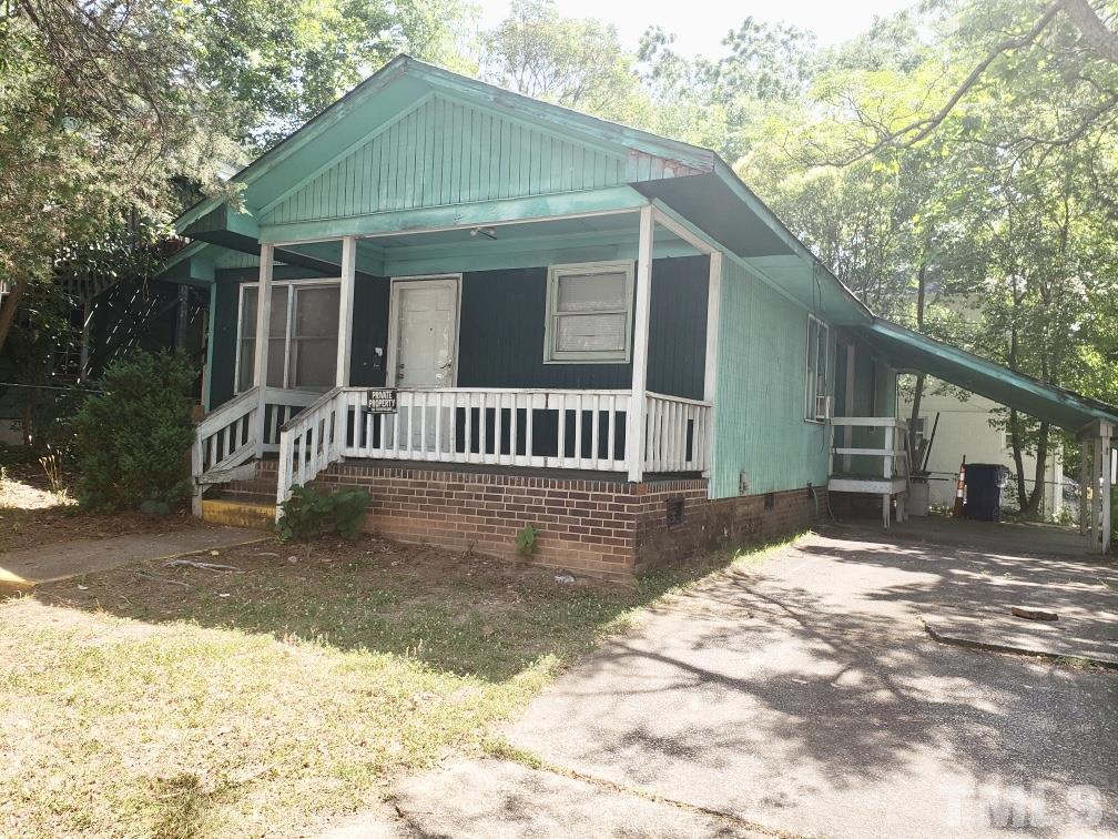 102 St Augustine Raleigh, NC 27610 - Photo 3 of 11 a front view of a house with a yard
