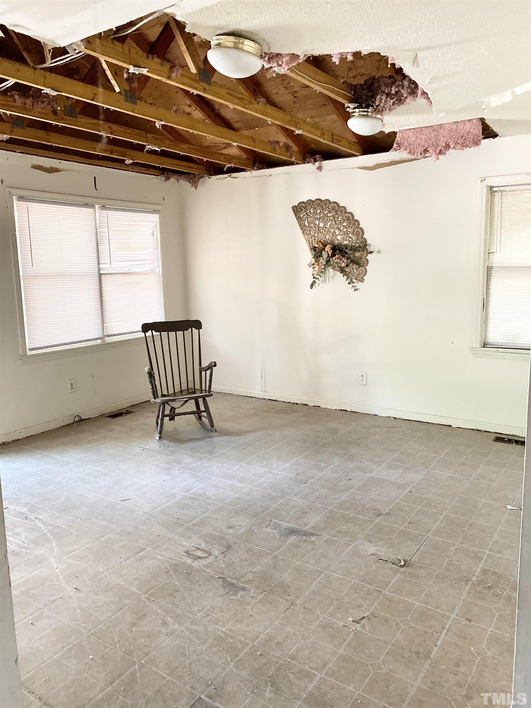 102 St Augustine Raleigh, NC 27610 - Photo 4 of 11 a view of a room with racks on the wall