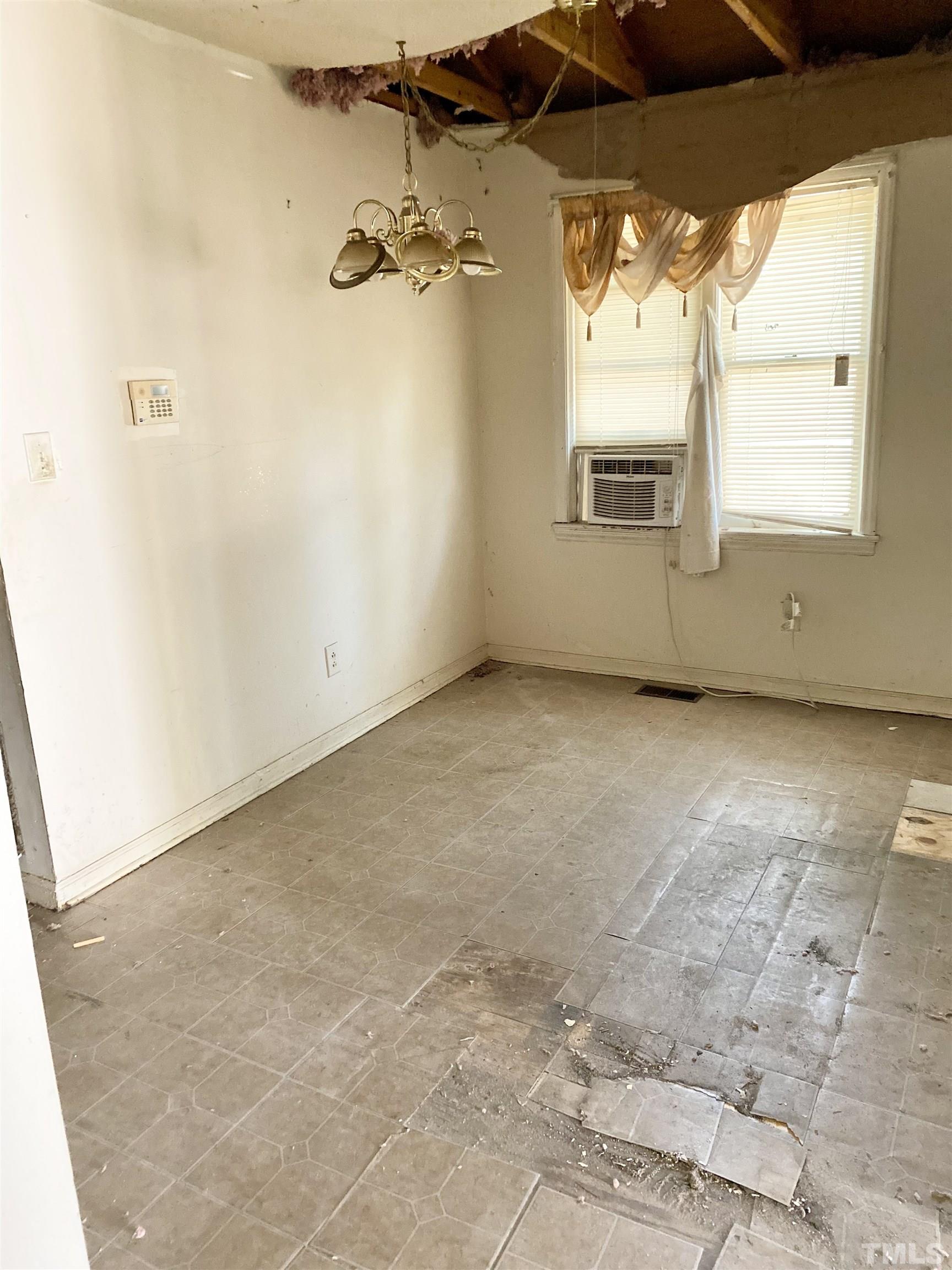 102 St Augustine Raleigh, NC 27610 - Photo 5 of 11 an empty room with a window