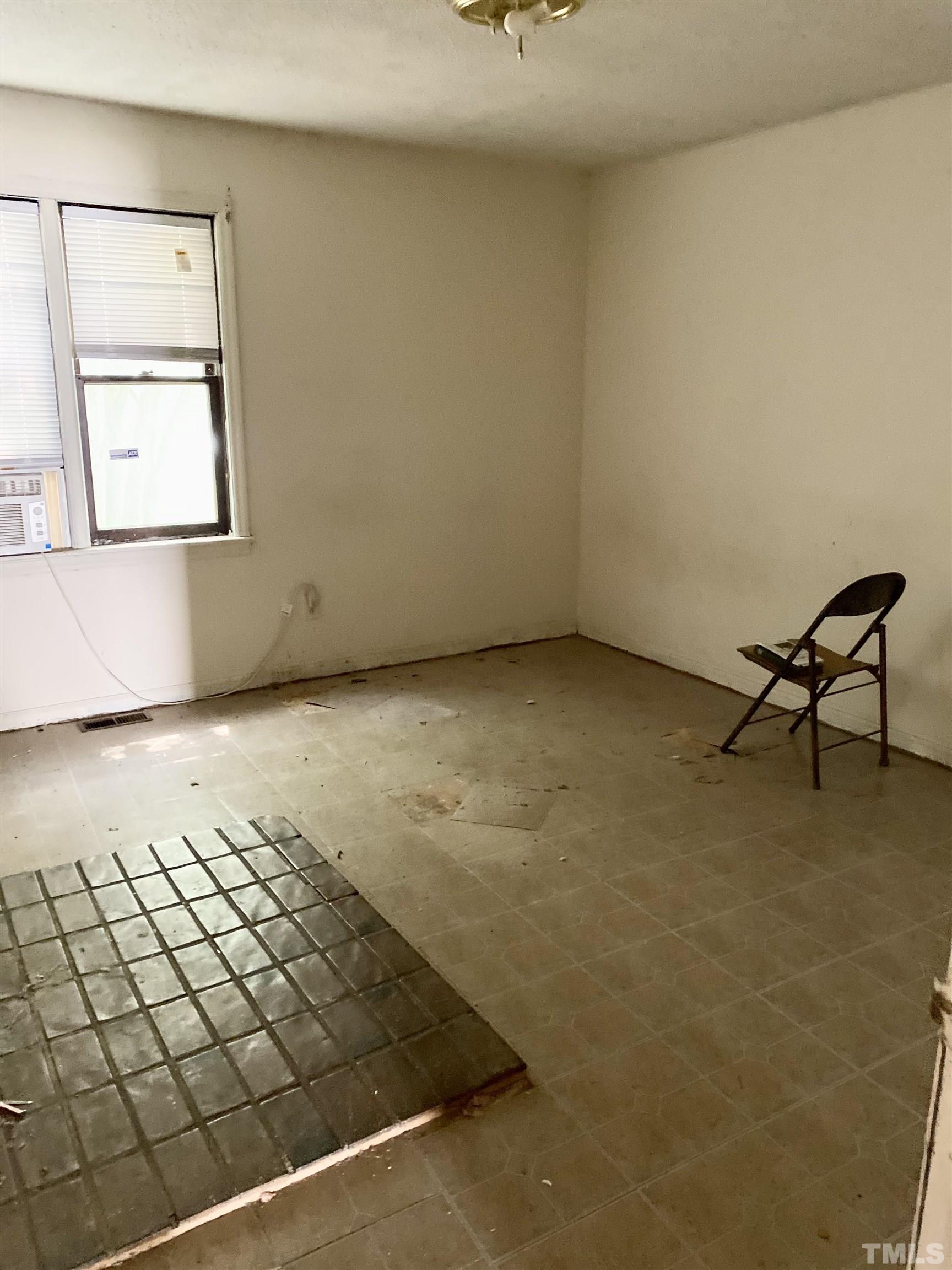 102 St Augustine Raleigh, NC 27610 - Photo 9 of 11 a view of a room with wooden floor