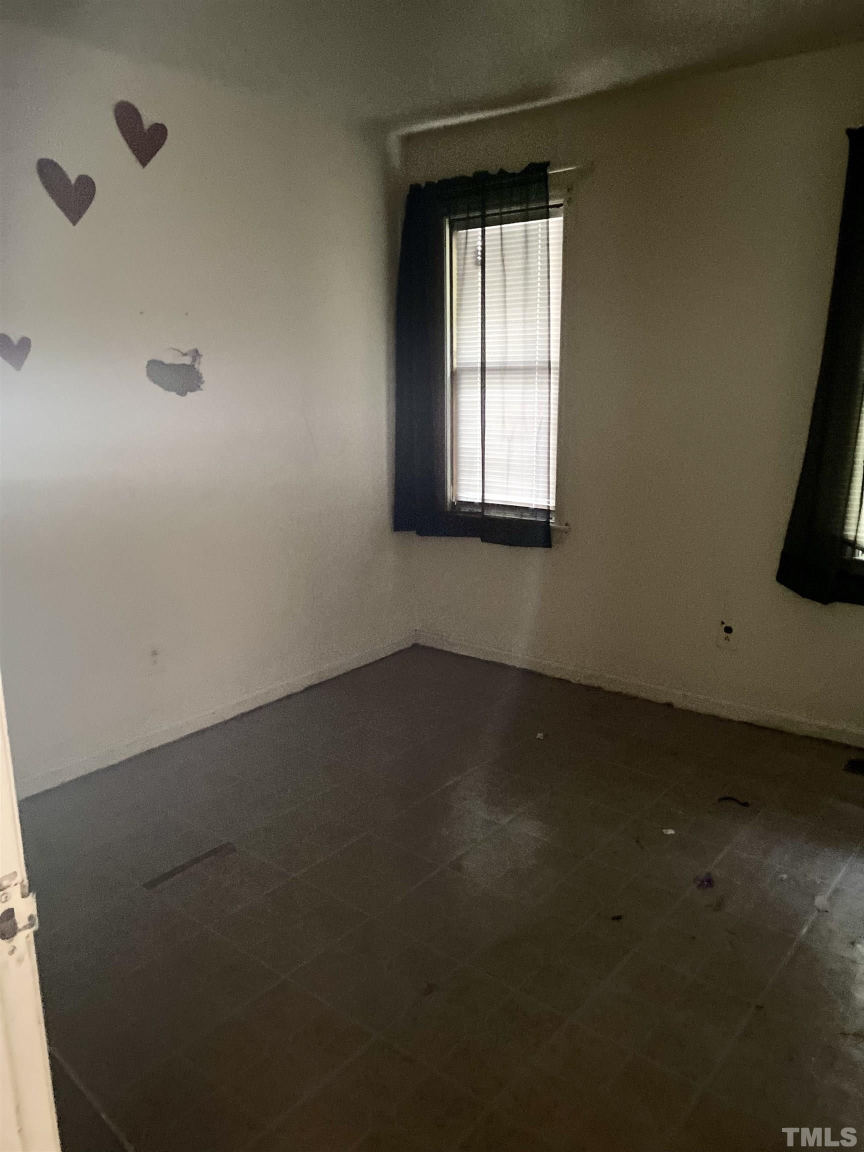 102 St Augustine Raleigh, NC 27610 - Photo 10 of 11 an empty room with a window