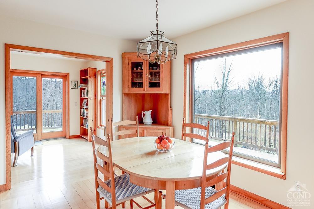 286 West Hill Road New Lebanon, NY 12125 - Photo 7 of 36 a dining room with furniture a chandelier and wooden floor