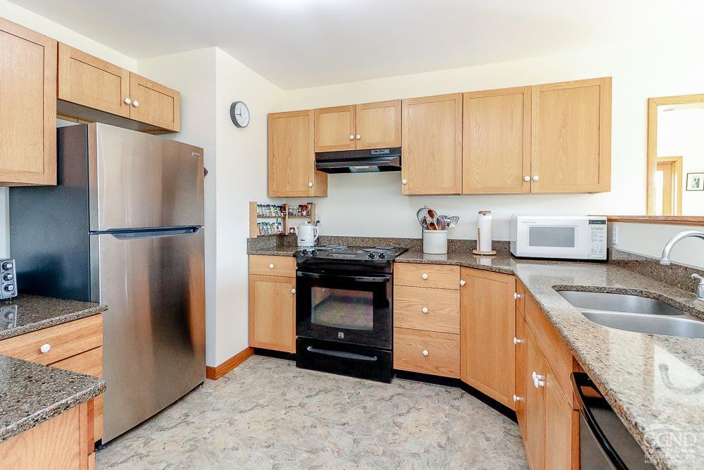 286 West Hill Road New Lebanon, NY 12125 - Photo 9 of 36 a kitchen with granite countertop a refrigerator stove and sink