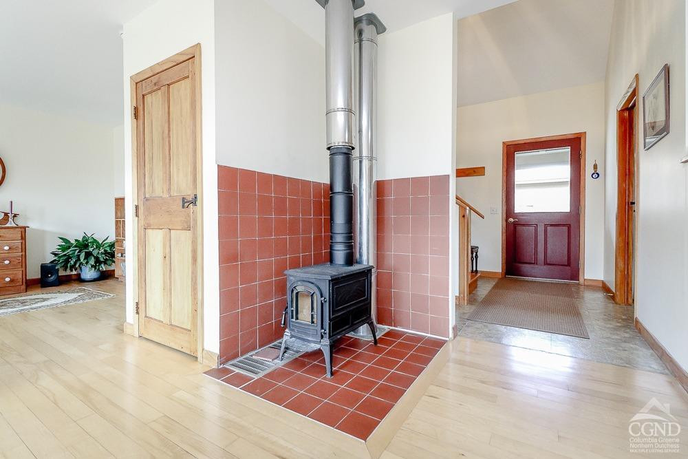 286 West Hill Road New Lebanon, NY 12125 - Photo 10 of 36 a view of a hallway with wooden floor and windows