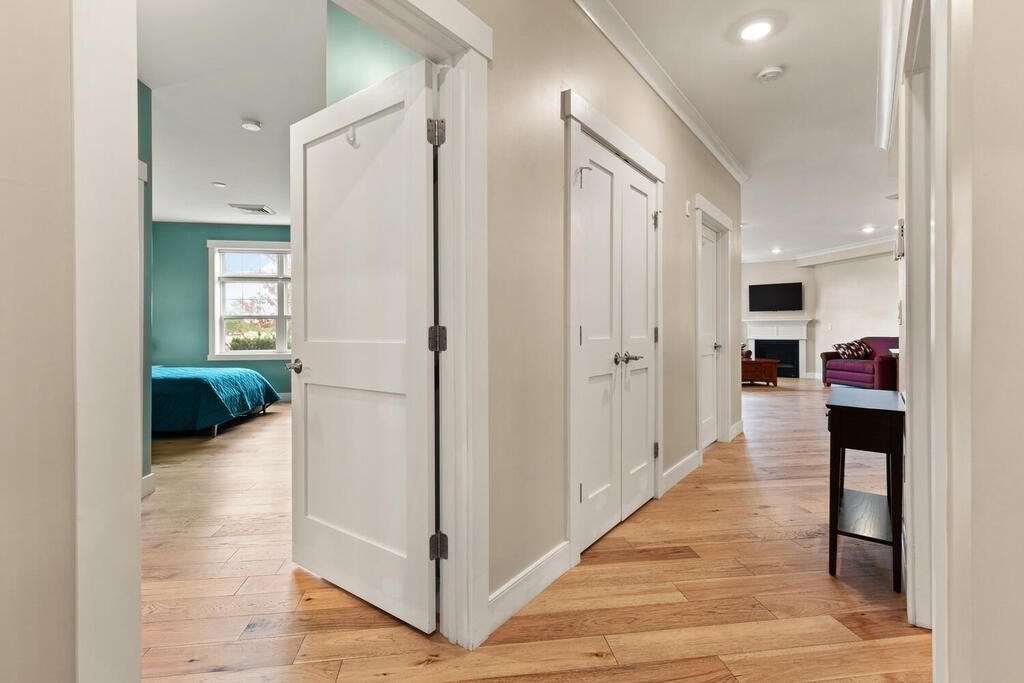11 Executive Drive, Unit 118 Stoneham, MA 02180 - Photo 13 of 36 a view of a hallway with kitchen view and living room view