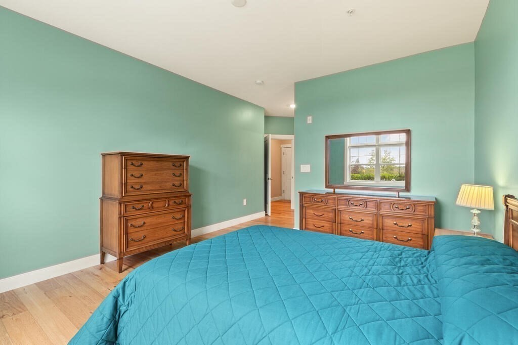 11 Executive Drive, Unit 118 Stoneham, MA 02180 - Photo 16 of 36 a room with furniture and a window