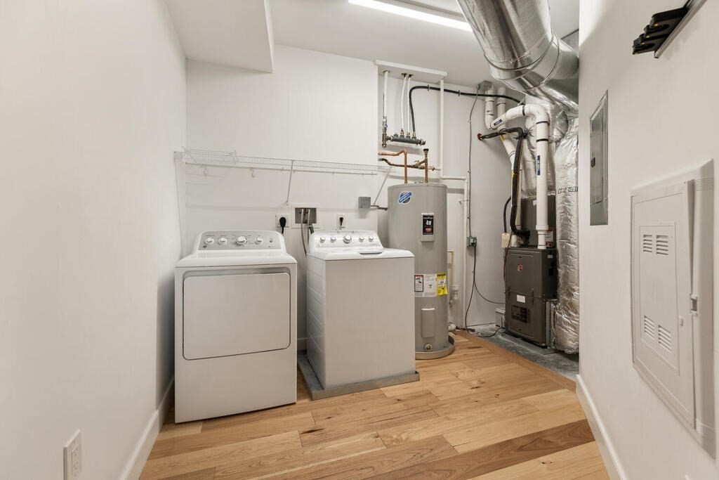 11 Executive Drive, Unit 118 Stoneham, MA 02180 - Photo 25 of 36 a utility room with dryer and washer