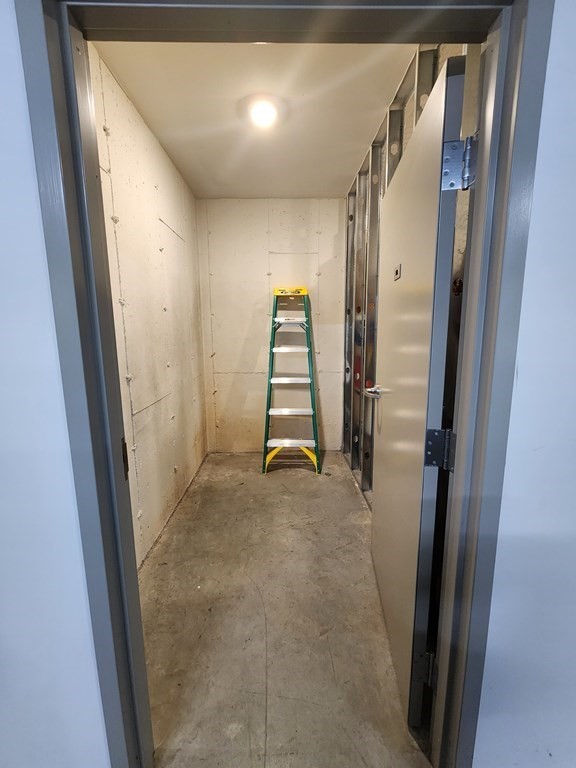 11 Executive Drive, Unit 118 Stoneham, MA 02180 - Photo 36 of 36 a view of a room with staircase and door