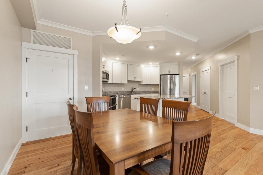 11 Executive Drive, Unit 118 Stoneham, MA 02180 - Photo 7 of 36 a view of a dining room and livingroom