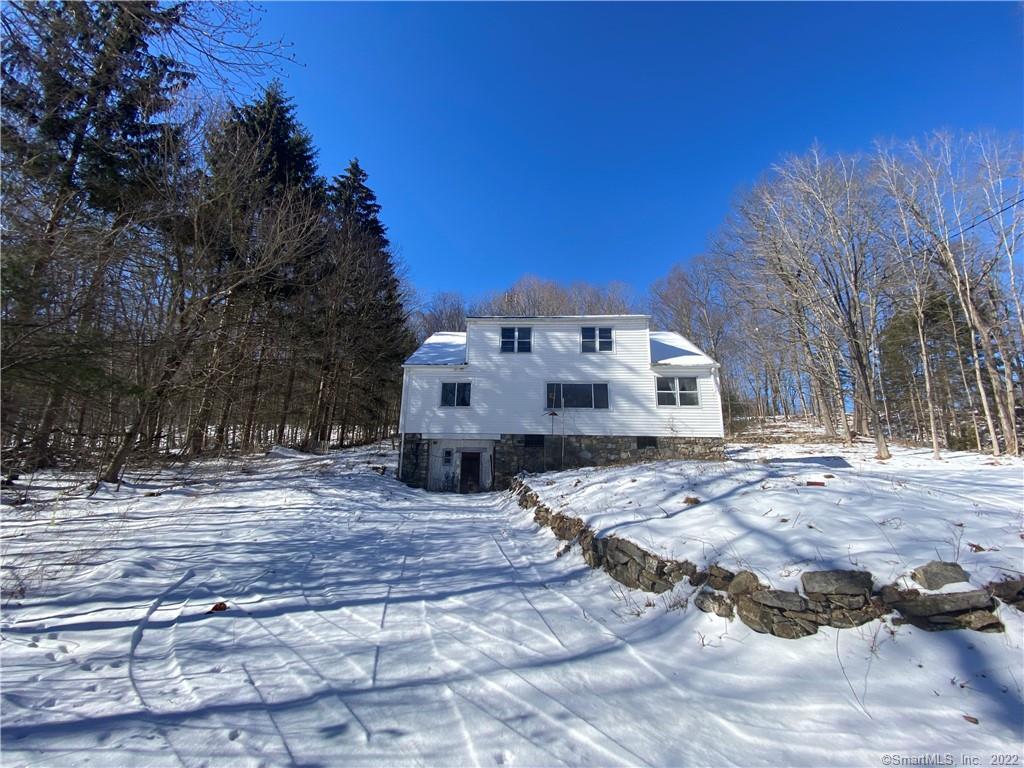 37 Long Meadow Road Oxford, CT 06478 - Photo 1 of 1 a view of a white house with a yard covered in snow