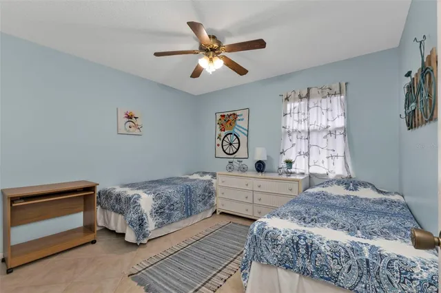 a spacious bedroom with a bed and a window