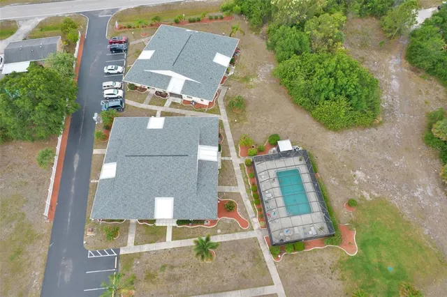 an aerial view of residential houses with outdoor space