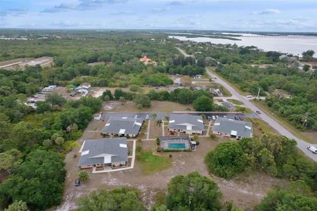an aerial view of a city with lake