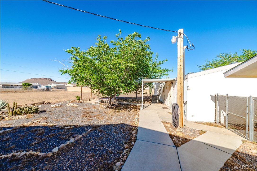 3176 West Malibu Road Golden Valley, AZ 86413 - Photo 31 of 62 The property features a concrete pathway leading to both detached garages