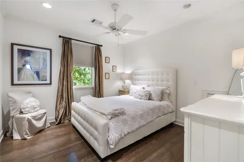 a bedroom with a bed and a table