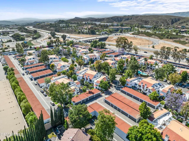 an aerial view of residential houses with outdoor space