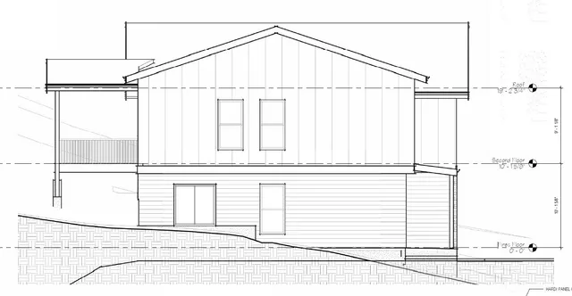 a white house with a white roof and a window