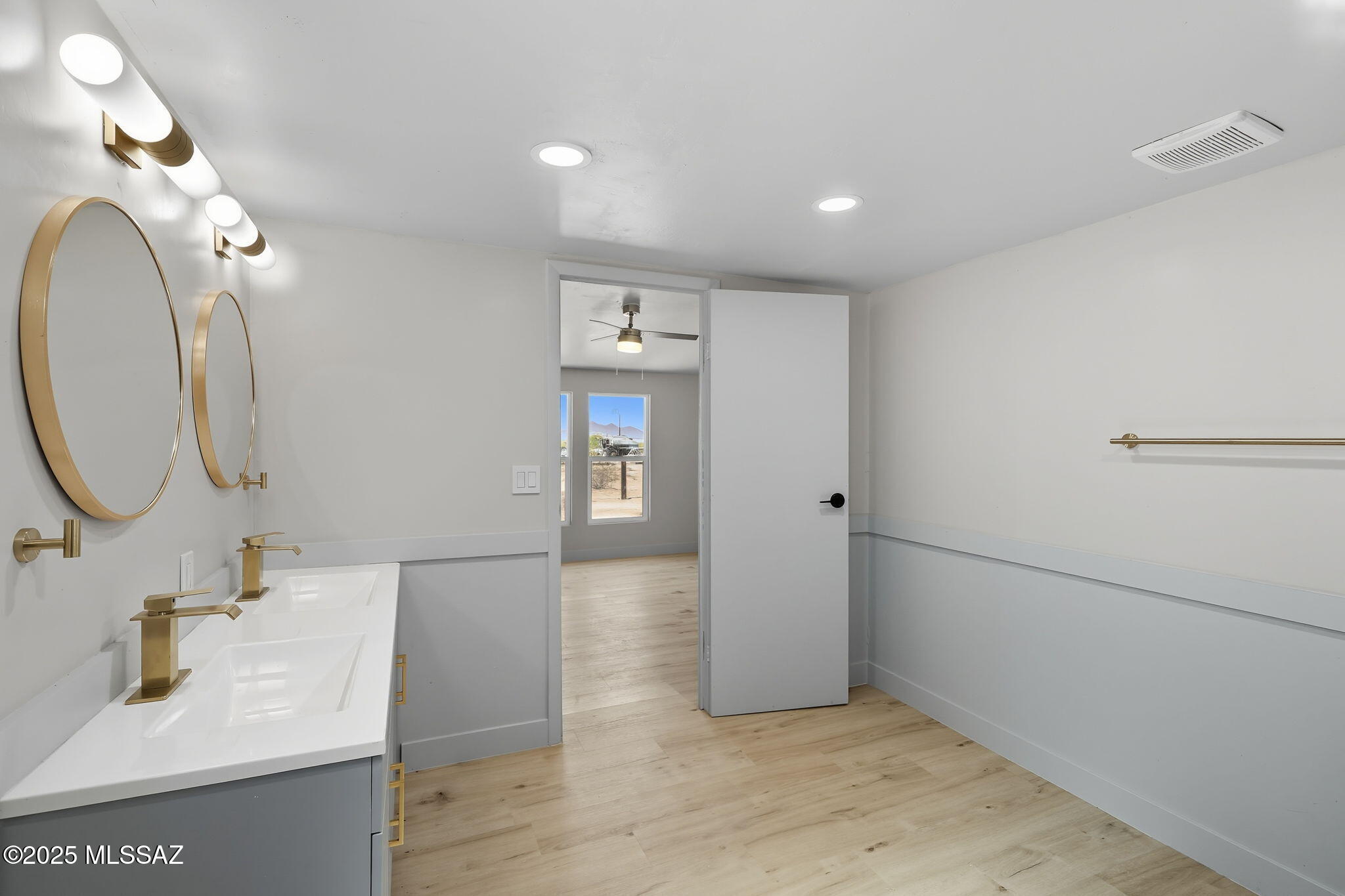 8790 North Trico Road Marana, AZ 85653 - Photo 17 of 35 a bathroom with a sink and a mirror