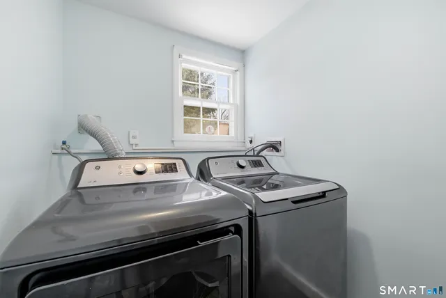 a utility room with washer and dryer