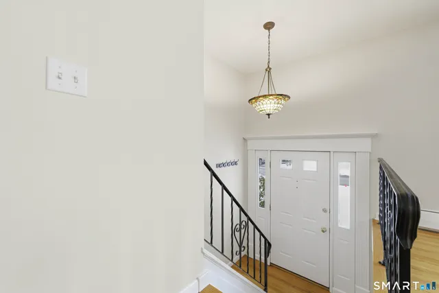 a view of a hallway with chandelier