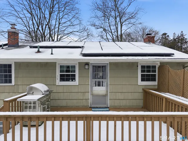 a front view of a house with glass windows