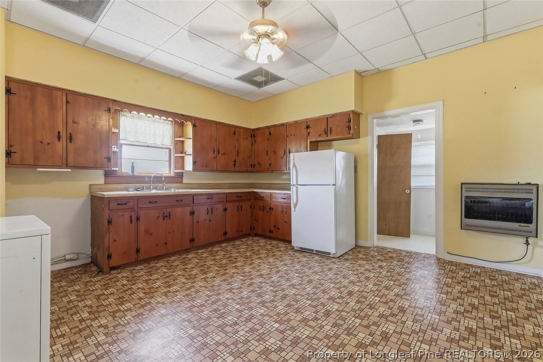 249 Nicholson Road Rockingham, NC 28379 - Photo 21 of 47 a kitchen with a refrigerator sink and cabinets