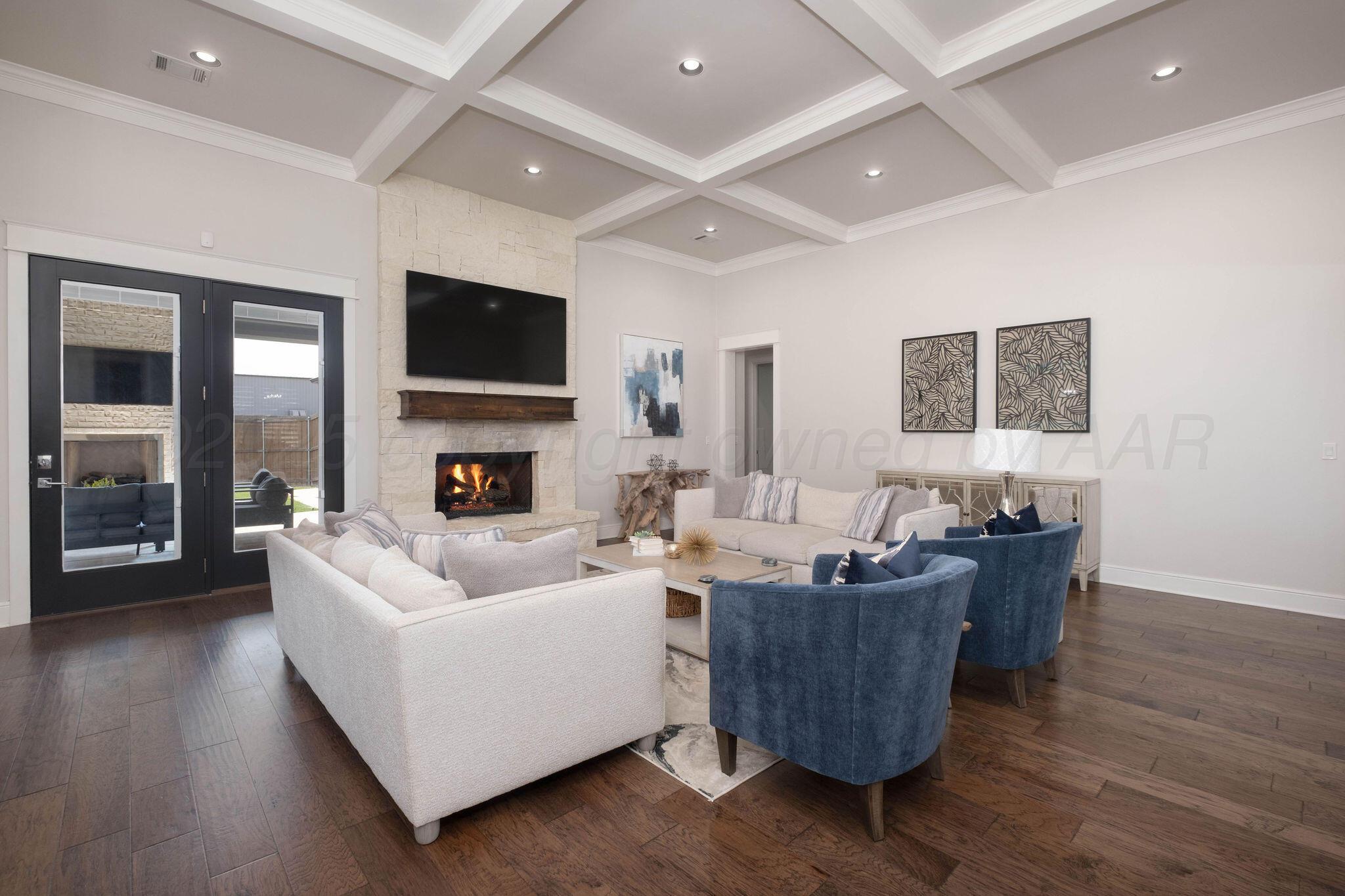 6103 Foley Square Street Amarillo, TX 79119 - Photo 11 of 52 a living room with furniture and a flat screen tv