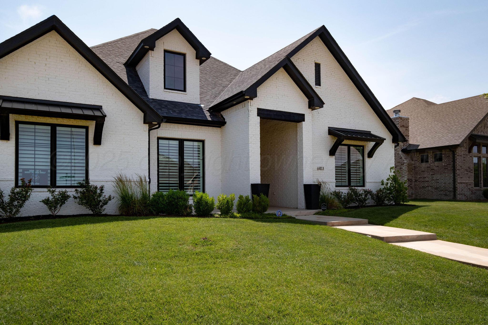 6103 Foley Square Street Amarillo, TX 79119 - Photo 4 of 52 a front view of a house with a yard