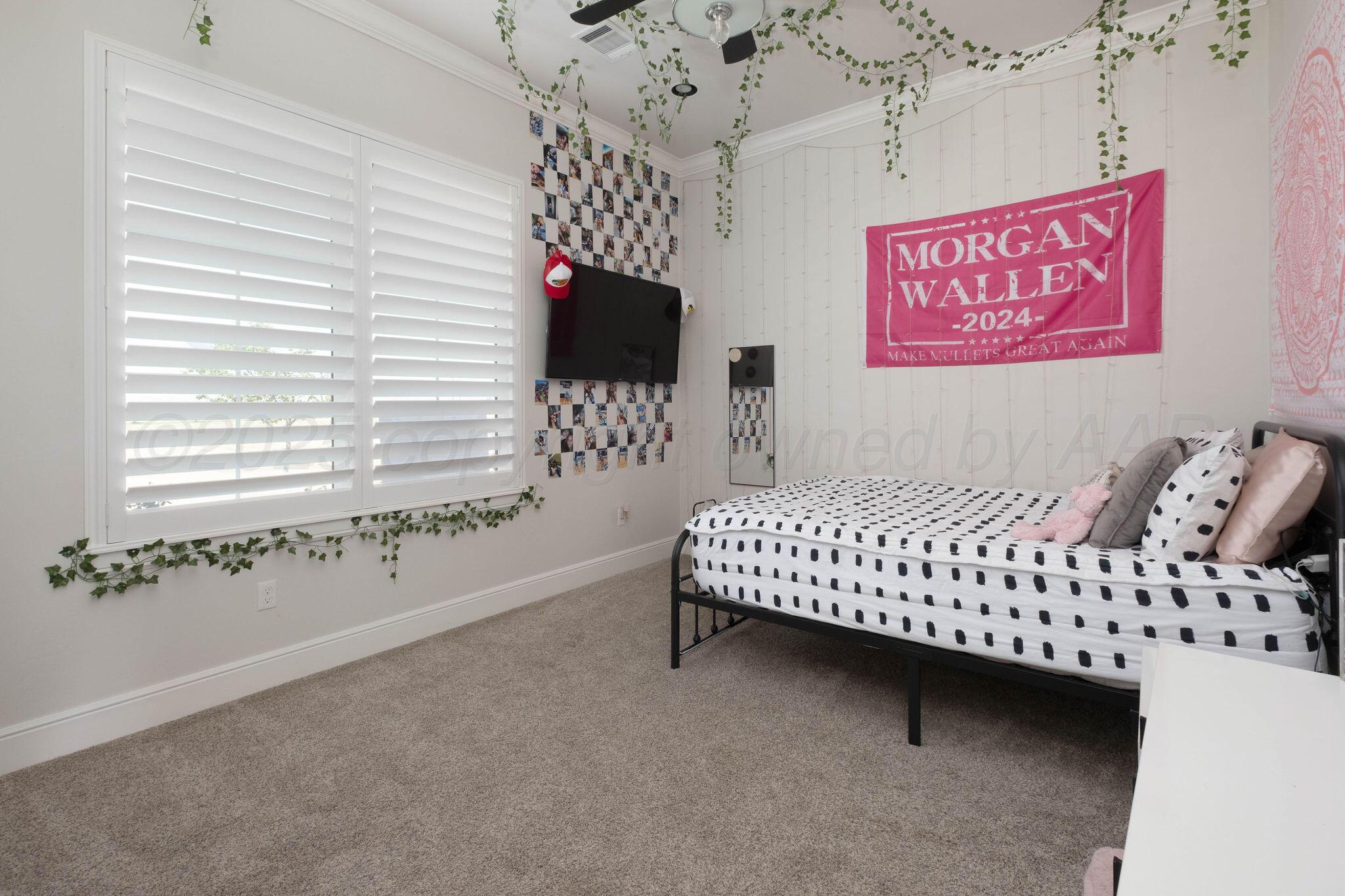 6103 Foley Square Street Amarillo, TX 79119 - Photo 41 of 52 a bedroom with furniture and a window