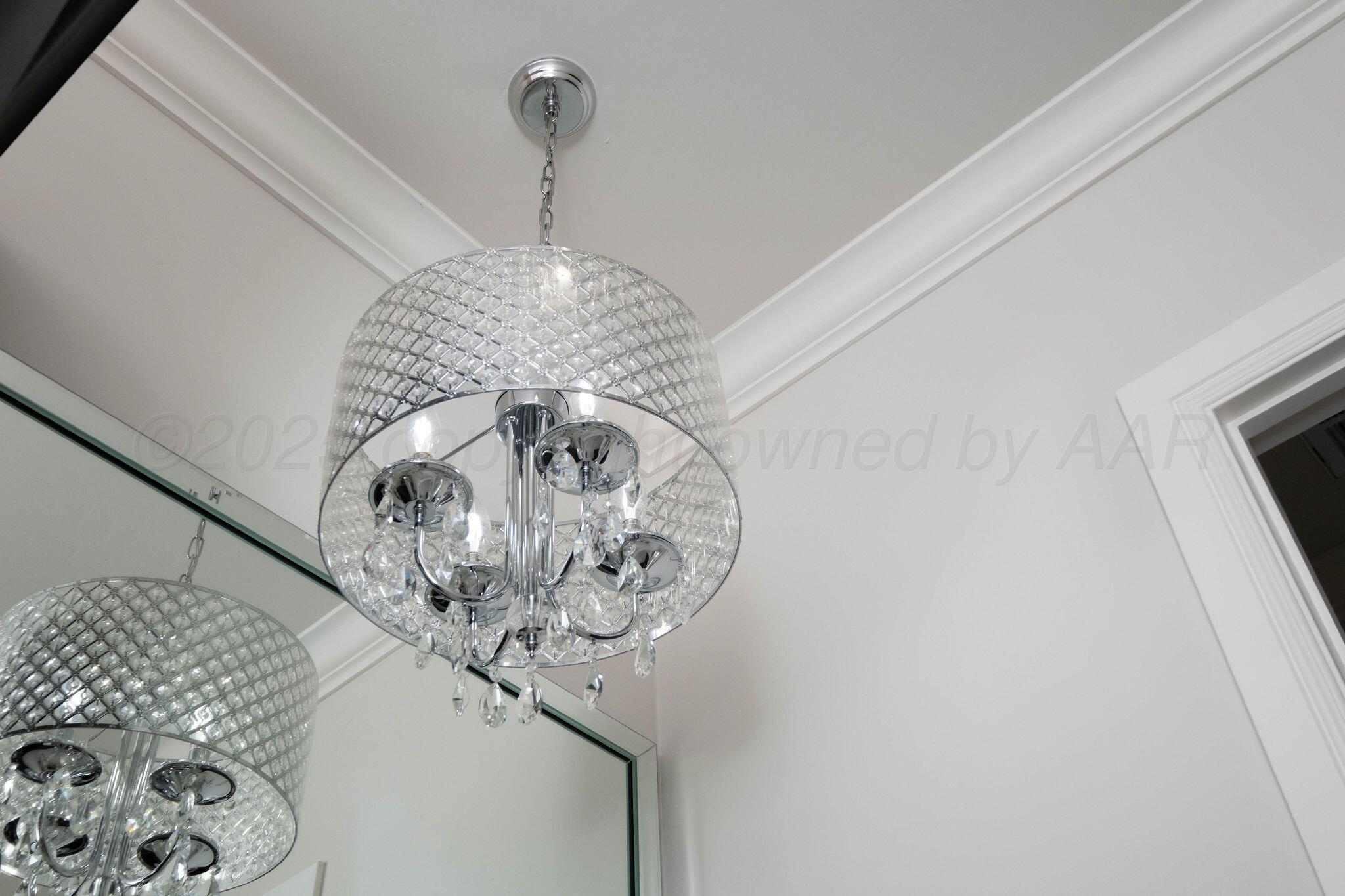 6103 Foley Square Street Amarillo, TX 79119 - Photo 45 of 52 a close up of a chandelier