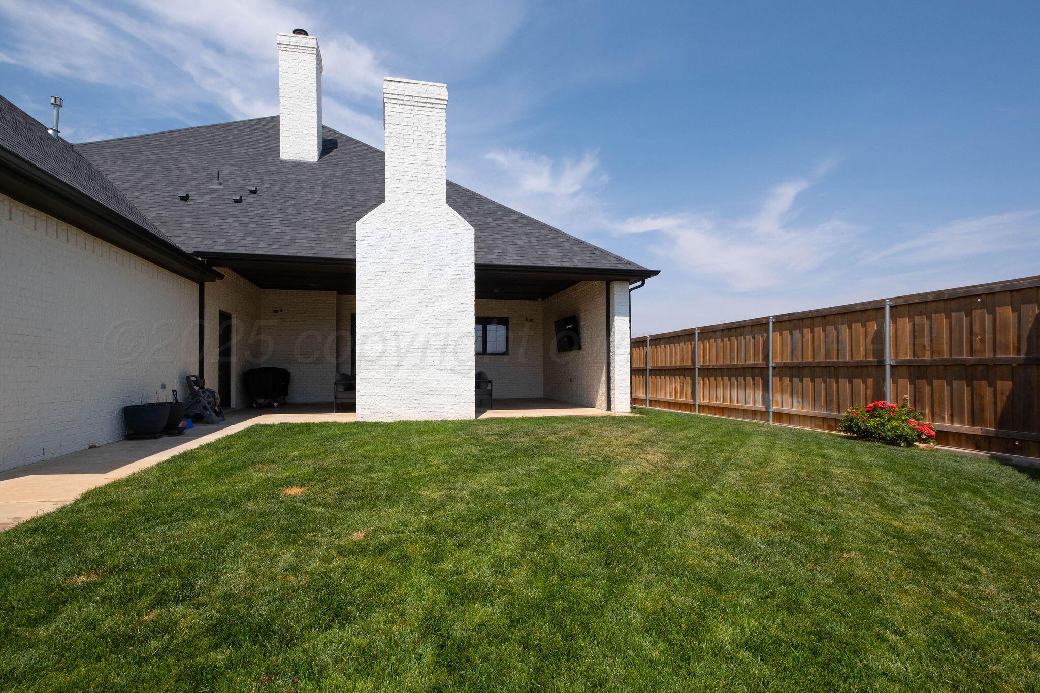 6103 Foley Square Street Amarillo, TX 79119 - Photo 51 of 52 a view of a house with backyard and garden