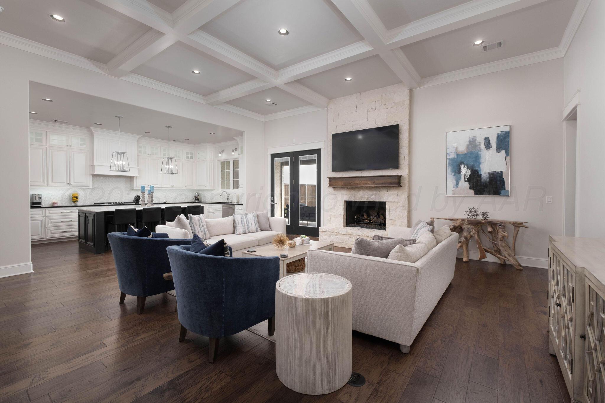 6103 Foley Square Street Amarillo, TX 79119 - Photo 9 of 52 a living room with fireplace furniture and a flat screen tv