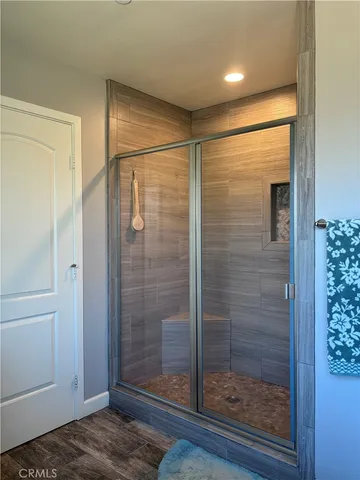a bathroom with a shower and a sink